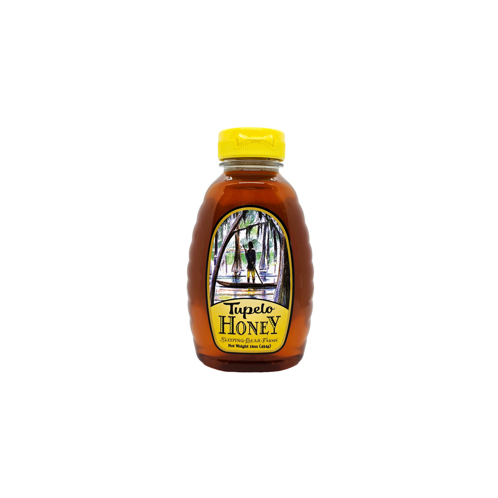 Front view of a plastic squeeze bottle of  Sleeping Bear Farms Tupelo honey